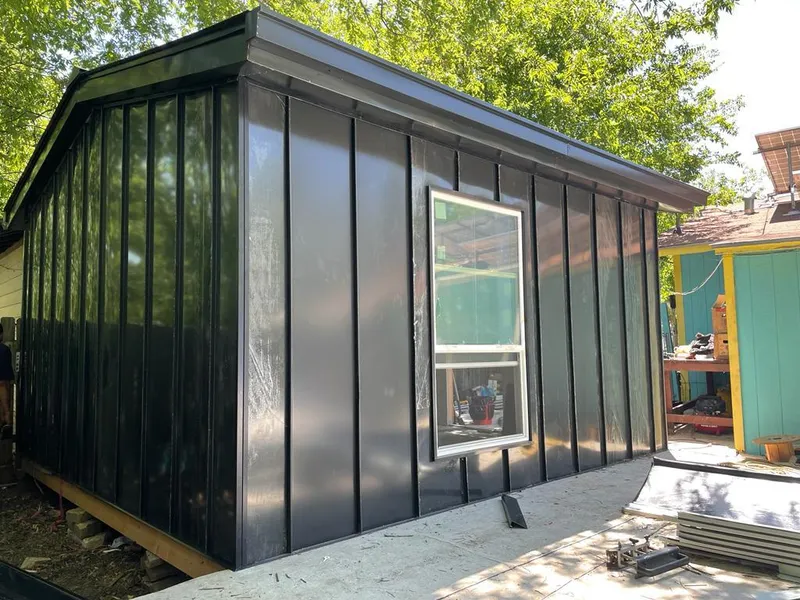 Black standing seam metal wall panels for Roof Inspection in Jersey Village