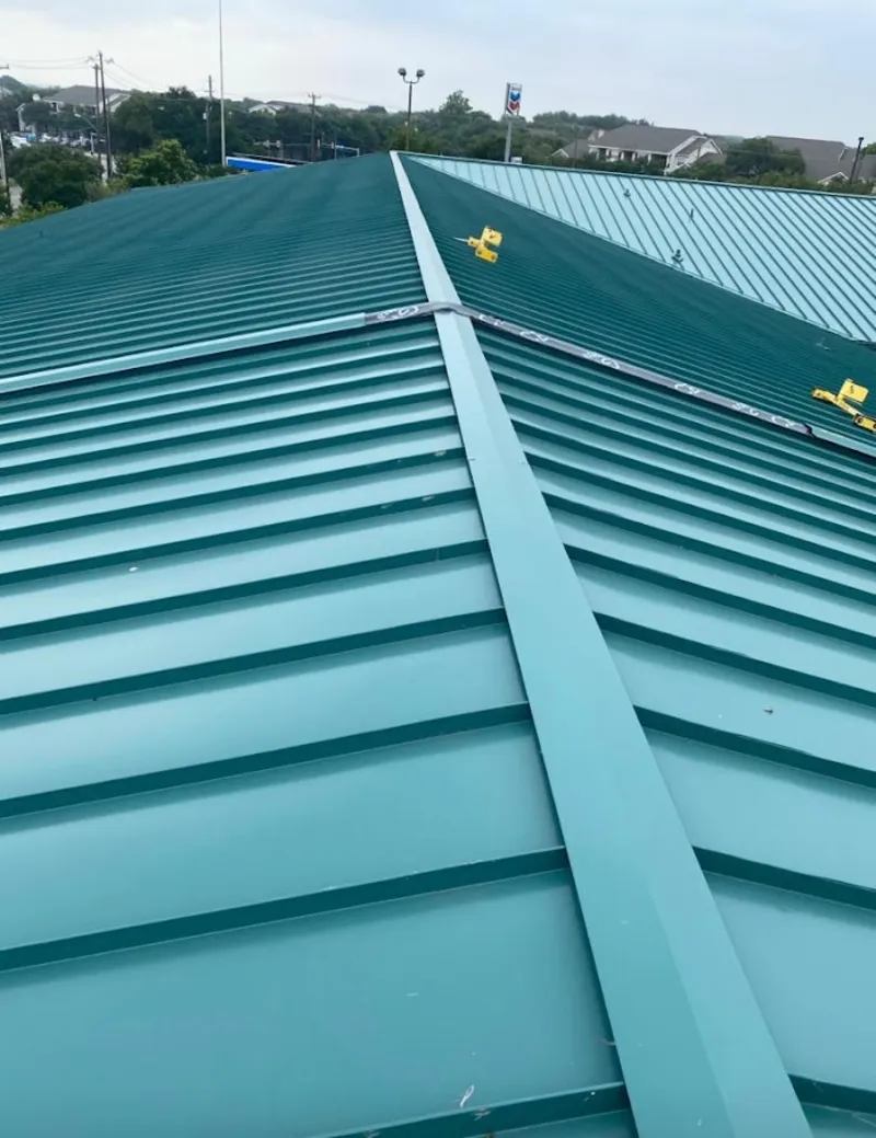 Green commercial metal roof ridge and valley for Metal Roof Repair in Jersey Village