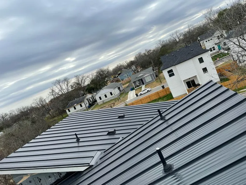 Standing seam metal roof panels with vents for Skylight Repair in Jersey Village